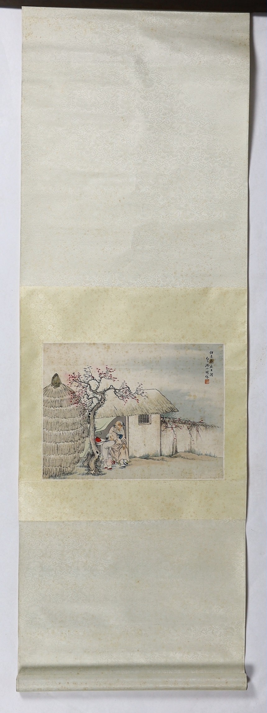 A Chinese scroll painting on paper of a sage and a boy in a hut, early 20th century, image 31.5cm x 42.5cm